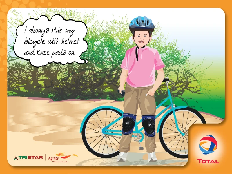 Child wearing helmet while riding bicycle safely